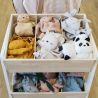 Doudou Lange en coton bio Panda dans son stand avec d'autres doudous